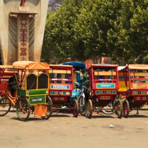 Antsirabe, Madagascar - October 26th, 2017:An Obelisk in the main street of Antsirabe depicting the tribes of Madagascar with rickshaws